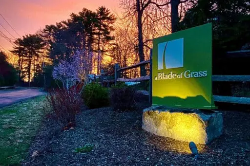 Sudbury, MA - The a Blade of Grass sign at our office reflects more than 30 years as a locally owned landscape design, construction, and maintenance company serving homeowners throughout Greater Boston.