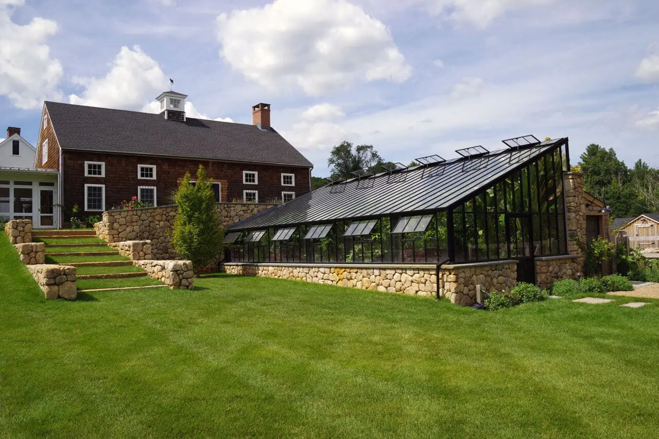Carlisle, MA - Stone steps link the farmhouse to the greenhouse, emphasizing daily movement between living and growing spaces.