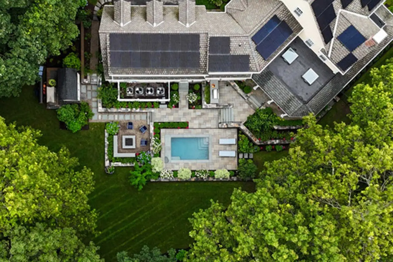 Wellesley, MA - From above, the full landscape plan reveals a carefully organized composition of pool terrace, fire feature, screened porch, and connecting garden spaces.