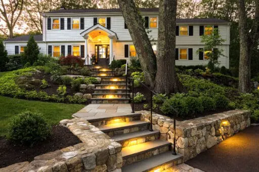 Step lighting improves visibility and confidence while blending seamlessly into the surrounding landscape.