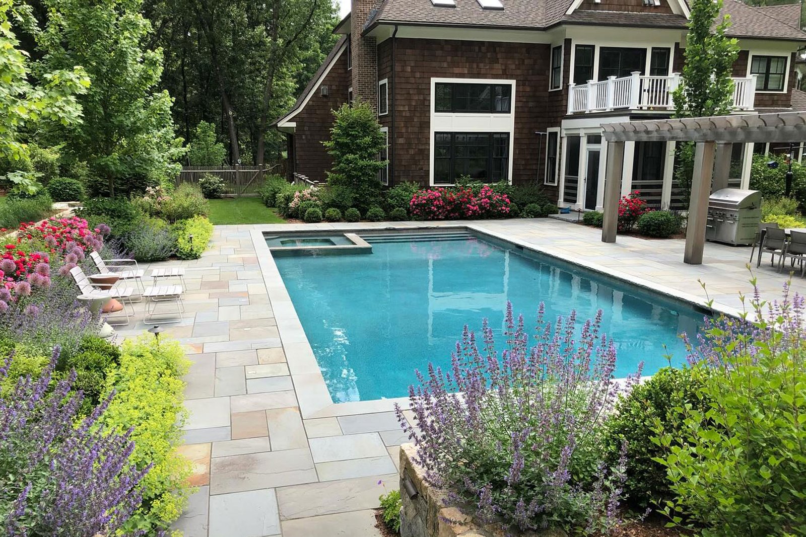 Renovated Dover backyard with pool, fireplace, and patio