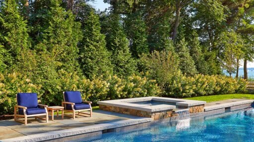 Duxbury, MA - A mixed planting provides both privacy screening a beautiful backdrop for the pool.