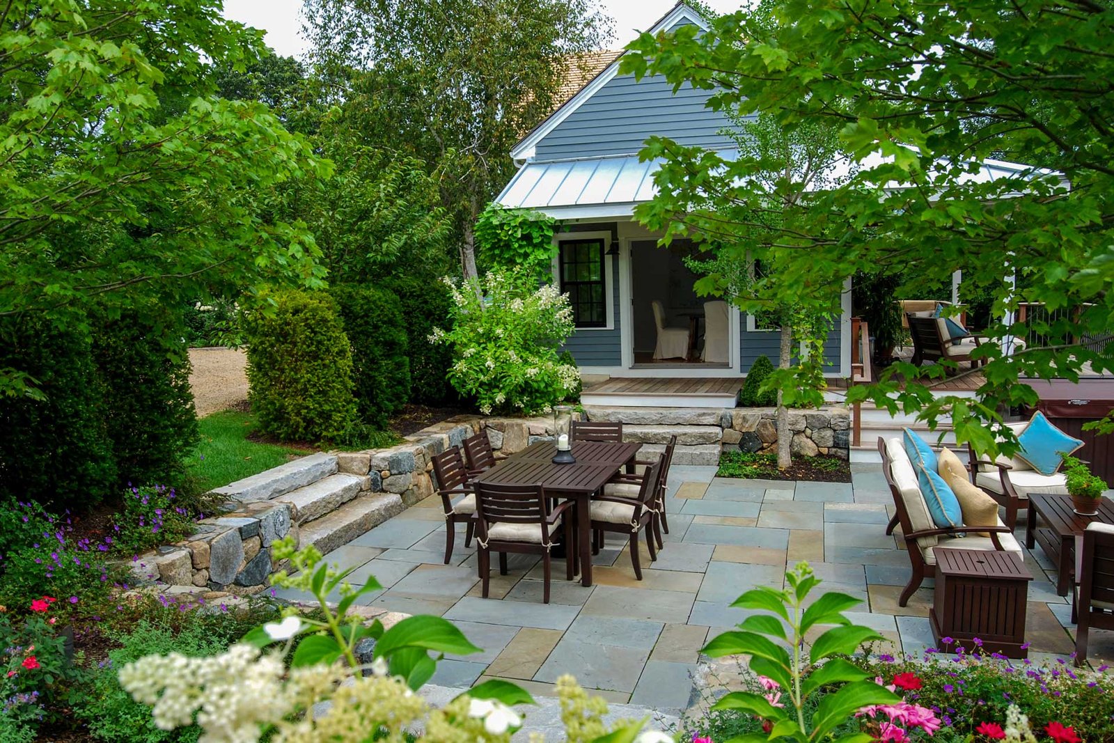 Wayland sunken patio with dining area and garden planting