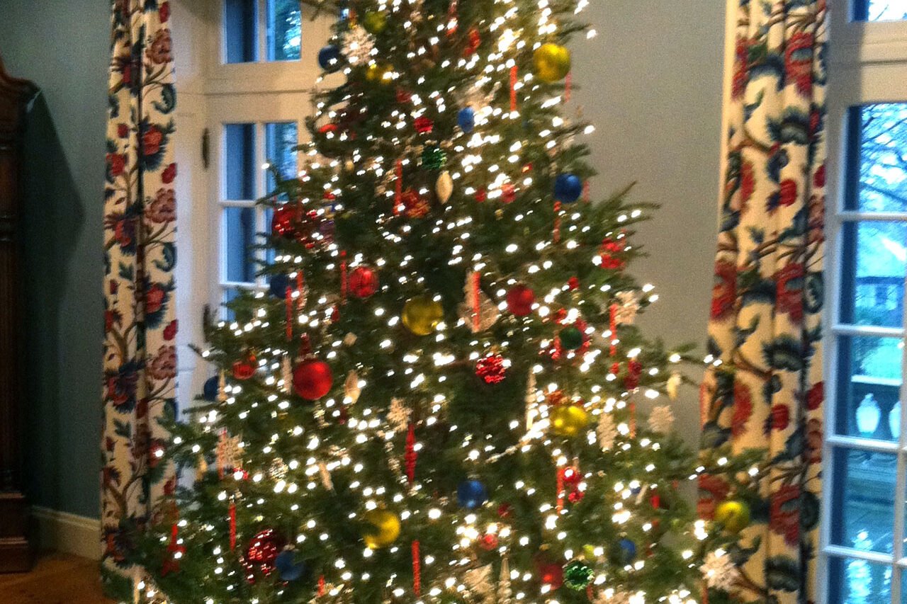 Decorated indoor Christmas tree in a classic New England home in Boston, surrounded by traditional holiday décor.
